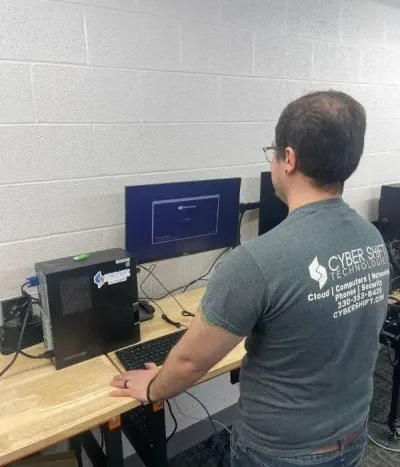 A Cyber Shift team member at a support workstation A Cyber Shift team member at a support workstation